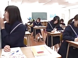 Japanese school girl blowing cock through gloryhole in class